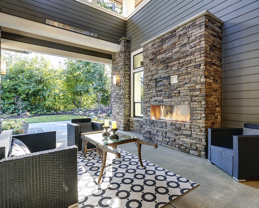 Outdoor living space with chimney and sitting area