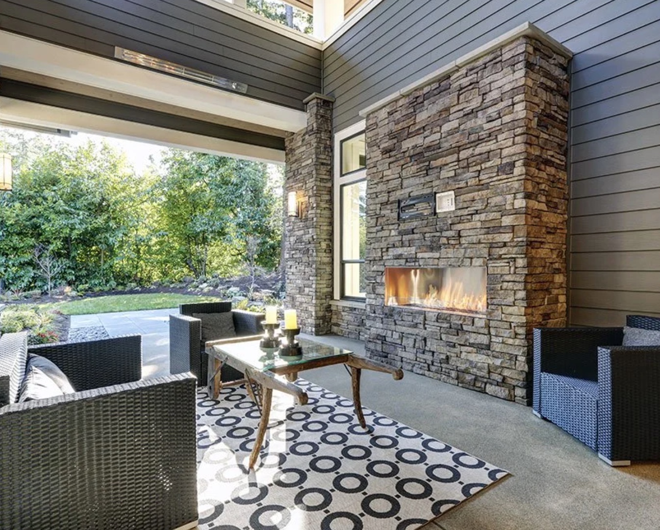Outdoor fireplace and patio with modern design - Newton MA Home Remodeling Exponential Construction Corp.