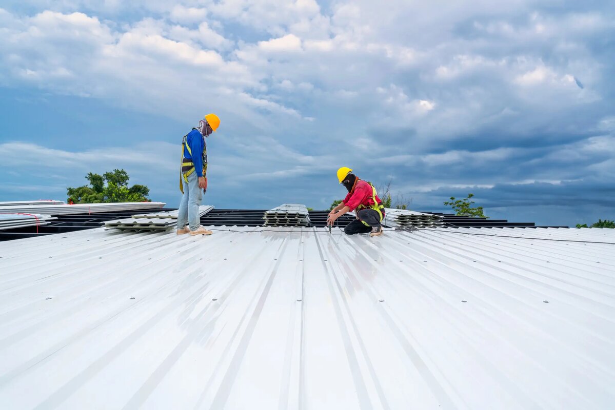 Professional roofing team installing commercial roof in Massachusetts