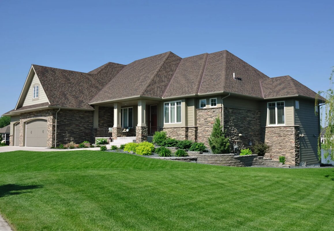 Luxury Massachusetts home with premium architectural roof and stone facade